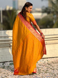 festive yellow silk saree with intricate bandhani zari work