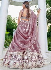 Elegant lavender bridal lehenga with embroidery and cutwork border