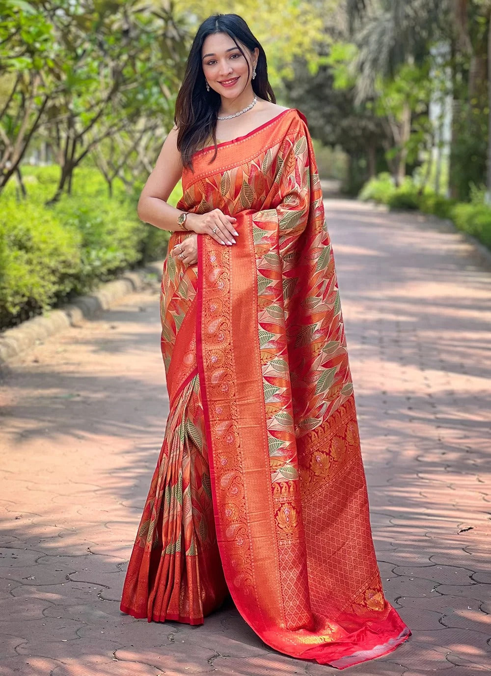 Orange kanchipattu silk saree with border
