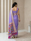 traditional lavender soft silk saree with floral motifs and rich pallu detail