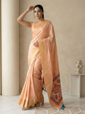 traditional peach silk saree with floral motifs and rich pallu detail
