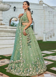 Opulent green tissue designer lehenga choli with embroidered blouse