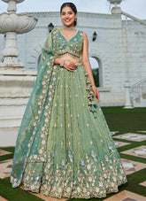 Captivating green tissue bridal lehenga choli with sequins embroidery