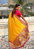 Rich woven pallu on mustard Darbari saree