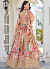 Woman wearing a colorful traditional outfit with a patterned dress and dupatta in an outdoor setting.