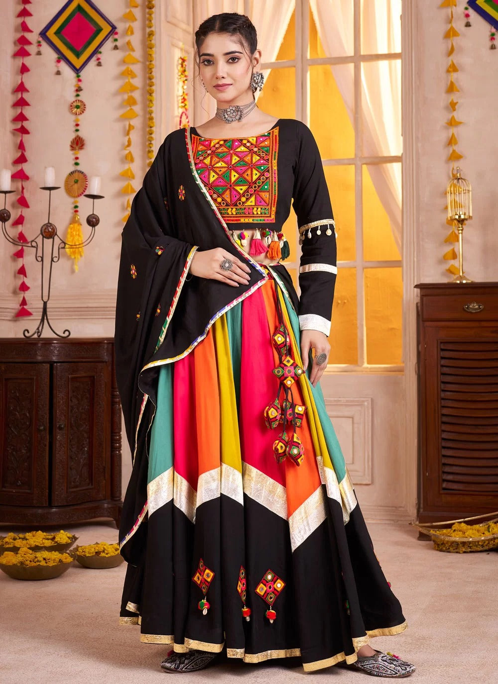 Traditional black Navratri lehenga with mirror work and kutchi embroidery