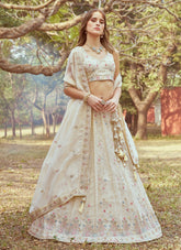 Cream lehenga design in tissue fabric