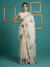 white muga cotton saree with elegant pencil art detailing