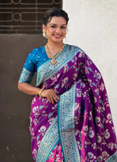 Woman wearing a purple and blue saree with a white background