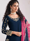 Woman wearing a navy blue embroidered outfit with a pink and white patterned dupatta.