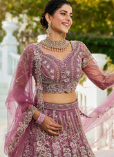 Lavender net bridal lehenga with burgundy embroidery
