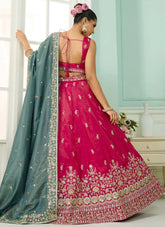 pink cosmos silk lehenga with beads, sequins, stone and thread embroidery, paired with teal dupatta and sweetheart neck blouse