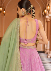 Pink tissue silk ring ceremony lehenga with zari embroidery