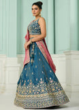 teal cosmos silk wedding lehenga with sequin, beads, and stone embroidery, paired with embroidered blouse and dupatta