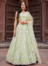 Lime green net mehndi lehenga choli with embroidery