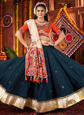 Teal blue lehenga with mirror and lampi border for Garba nights