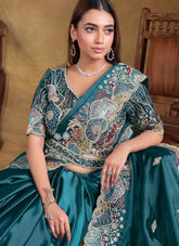 Close up of sequins, moti and stone hand work on blue satin silk saree