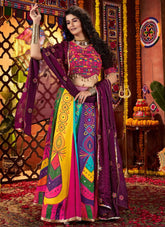 Woman in a colorful traditional outfit with a vibrant background