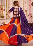 Woman wearing a colorful traditional outfit with a vibrant purple and orange design.