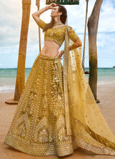 Mustard Bridal Net Sequins, Moti, Mirror and thread embroidery Lehenga choli