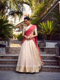 Off-white jacquard silk lehenga with golden zari weave