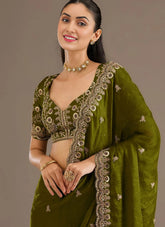 Olive green designer tissue silk saree with zari embroidery