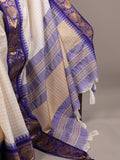 Traditional fabric with blue and gold patterns on a neutral background
