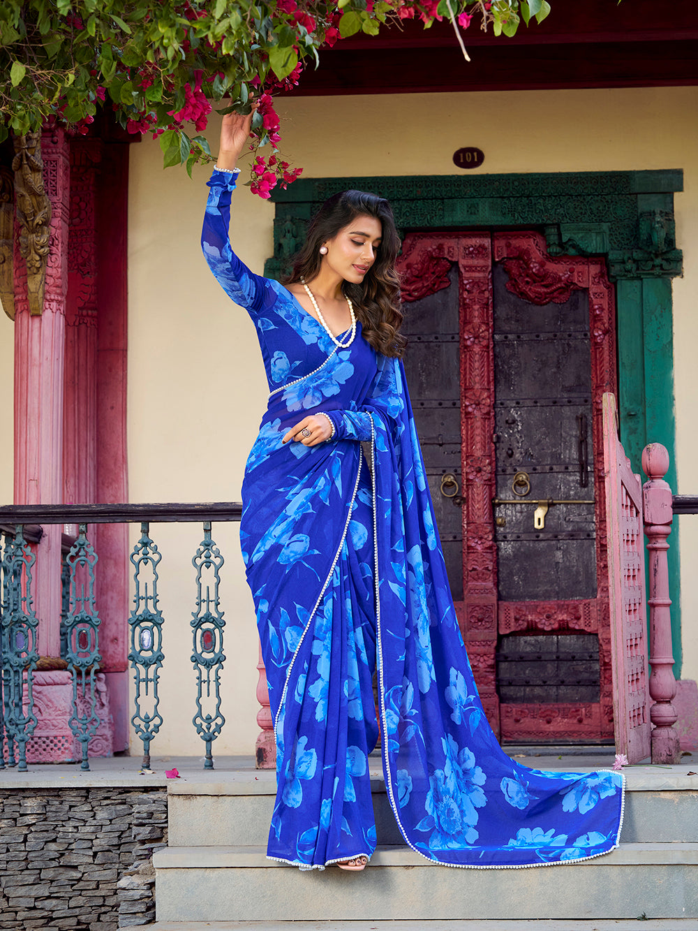 Blue chiffon floral printed saree with pearl lace border