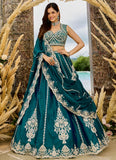 Rama silk wedding lehenga featuring sequins, coding and thread embroidery with a designer cutwork border.