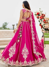 Designer Rani Pink silk lehenga set featuring an embroidered blouse and matching silk dupatta