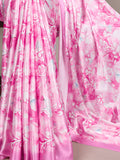 Close-up of pink floral fabric with a soft focus on a neutral background