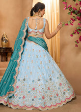 Turquoise blue tissue party wear lehenga with beads, sequins, stone embroidery and cutwork dupatta, featuring heavy flair for festive and engagement functions