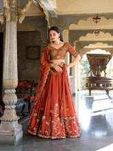 Rust orange Rangoli silk lehenga choli with embroidery