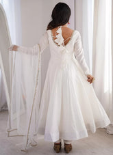 Elegant white reception wear Anarkali suit with full flare