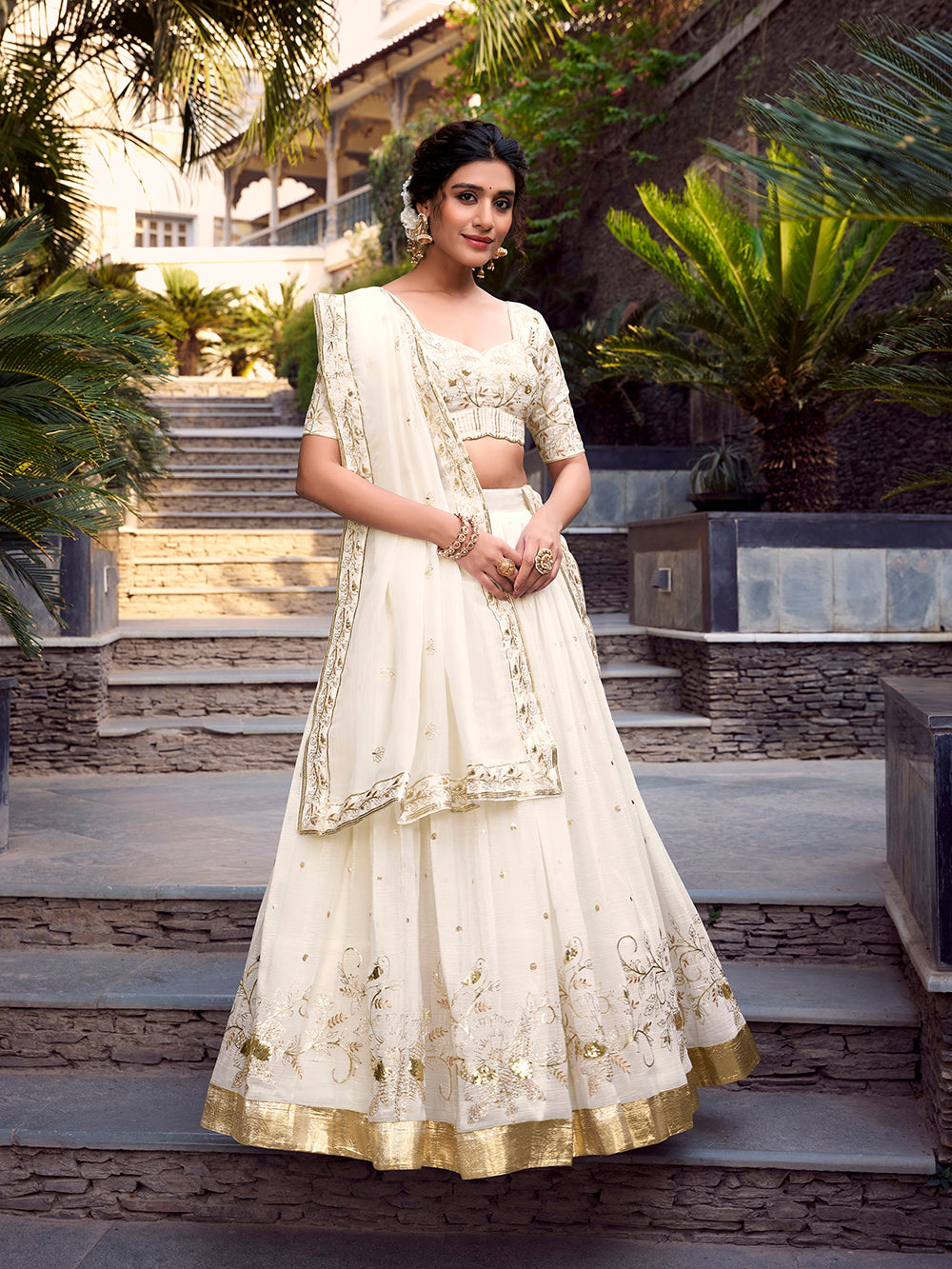 Off-white silver glossy lehenga choli with sequins embroidery