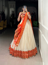 White lehenga with jacquard blouse and orange dupatta