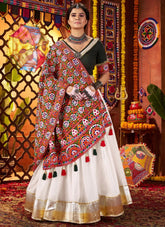 Woman in a traditional outfit with a colorful background