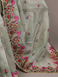 Embroidered fabric with floral and paisley patterns on a light green background