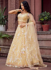 Yellow net haldi ceremony lehenga choli with embroidery