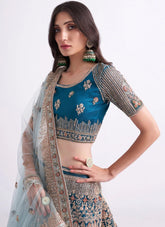 Teal Blue Net Designer Embroidered Lehenga Choli