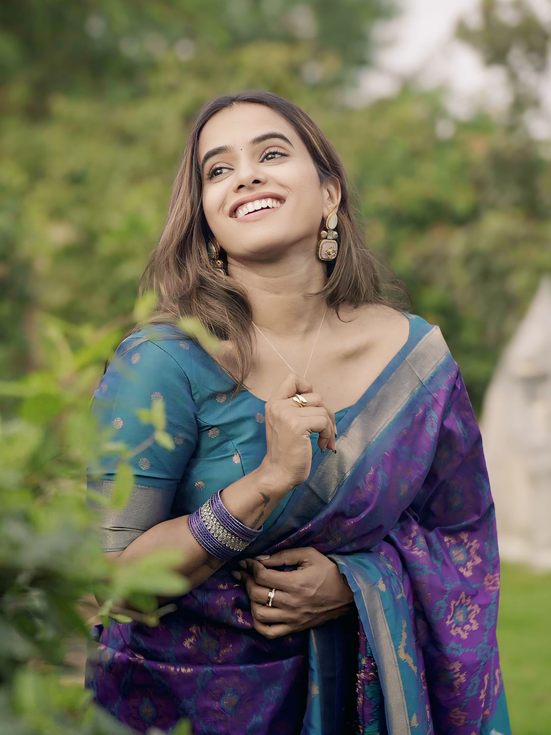 Rupali in our Purple Soft Silk Zari Woven Patola Saree with Contrast Weaves