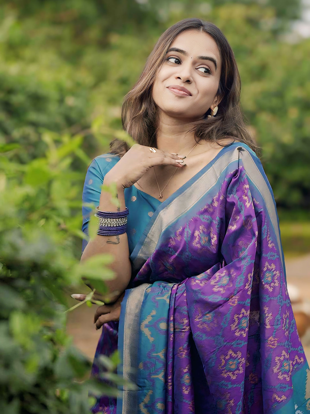 Rupali in our Purple Soft Silk Zari Woven Patola Saree with Contrast Weaves