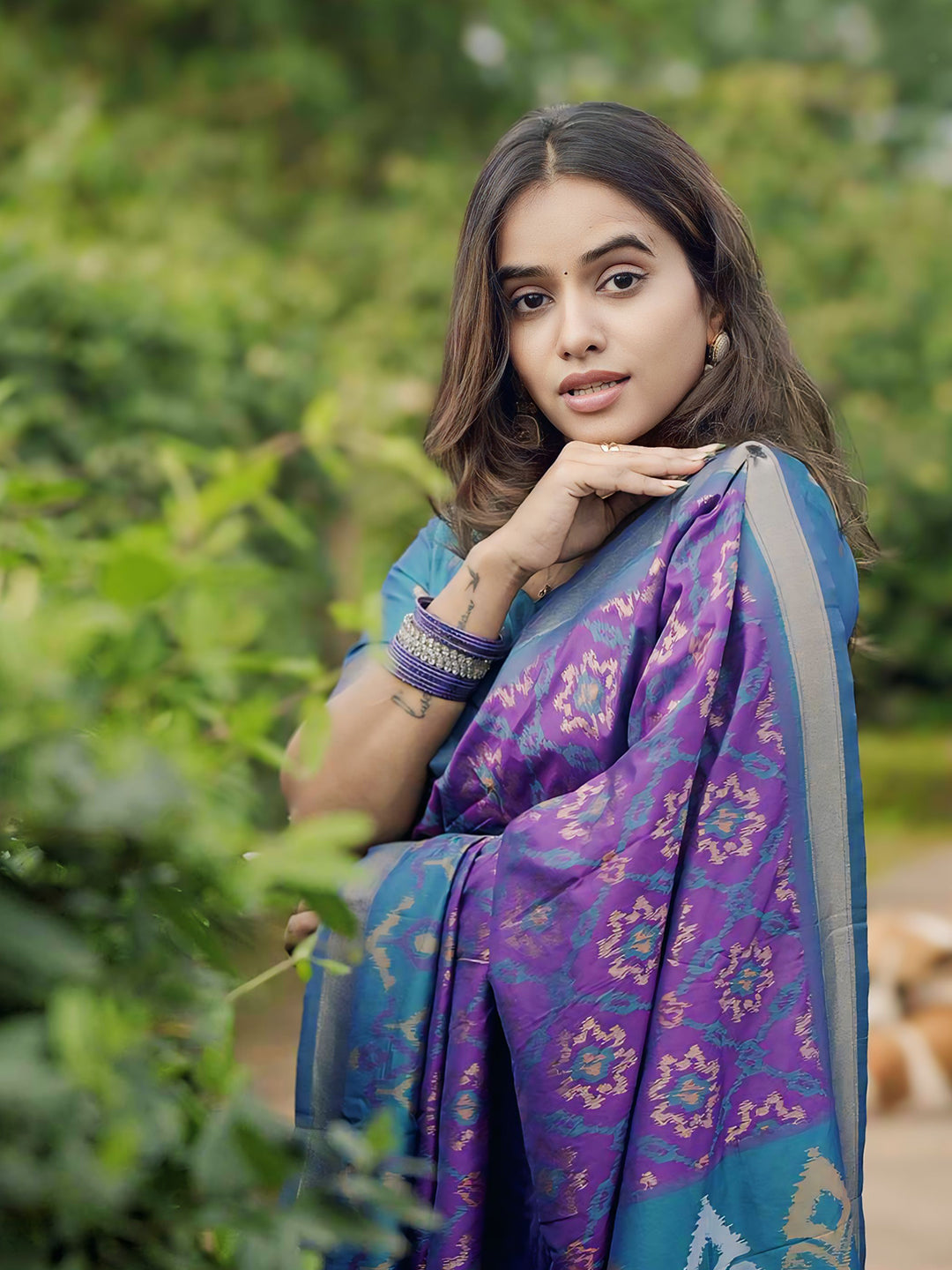 Rupali in our Purple Soft Silk Zari Woven Patola Saree with Contrast Weaves