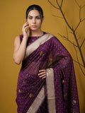 party wear wine organza saree featuring zari woven craftsmanship