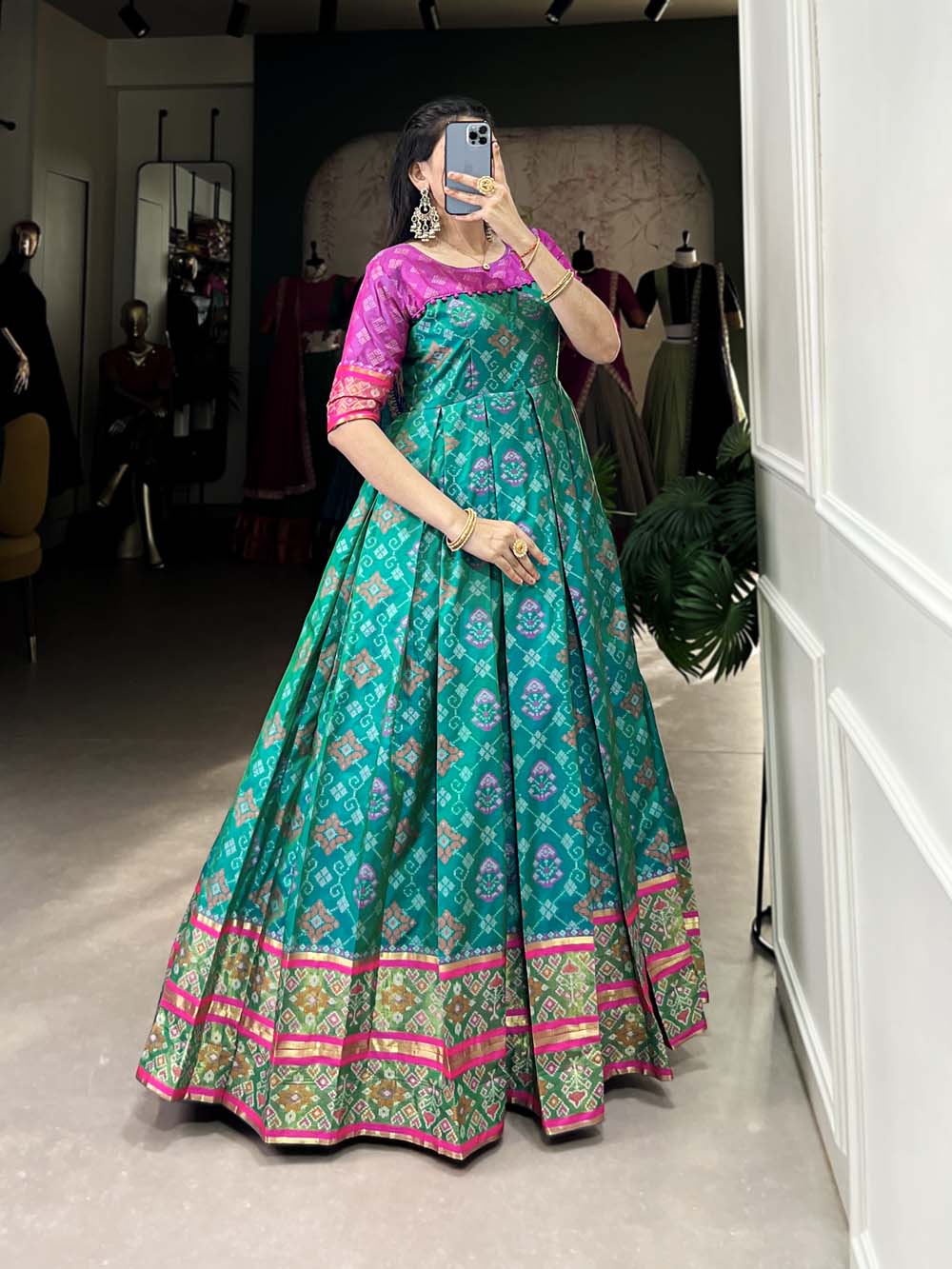 Bottle Green Color Jacquard Silk Patola Print With Zari Weaving Work Gown