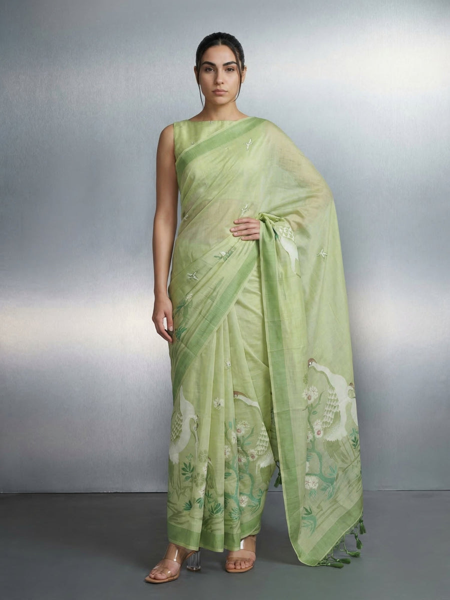 pista green muga cotton saree with resham weaving and art pallu