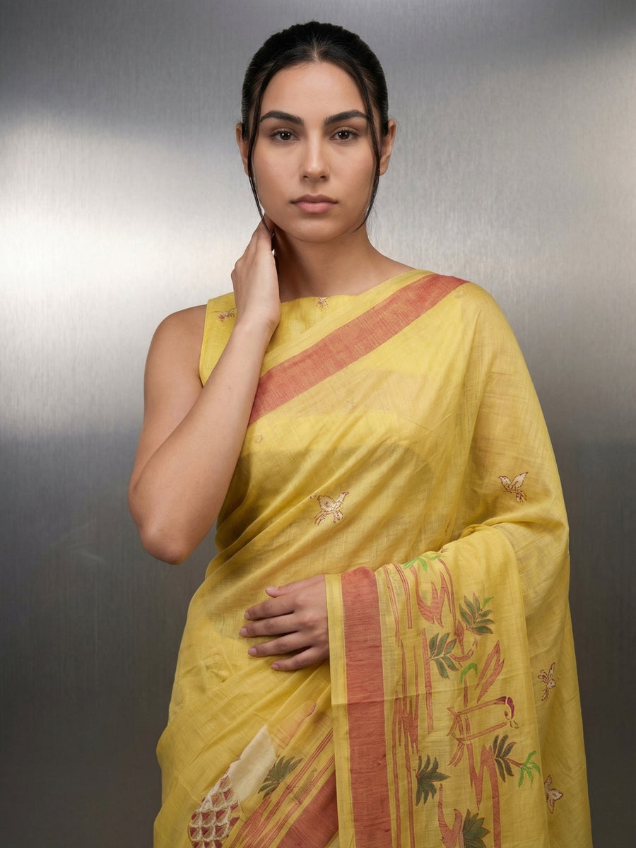 elegant yellow cotton saree with artistic woven detailing