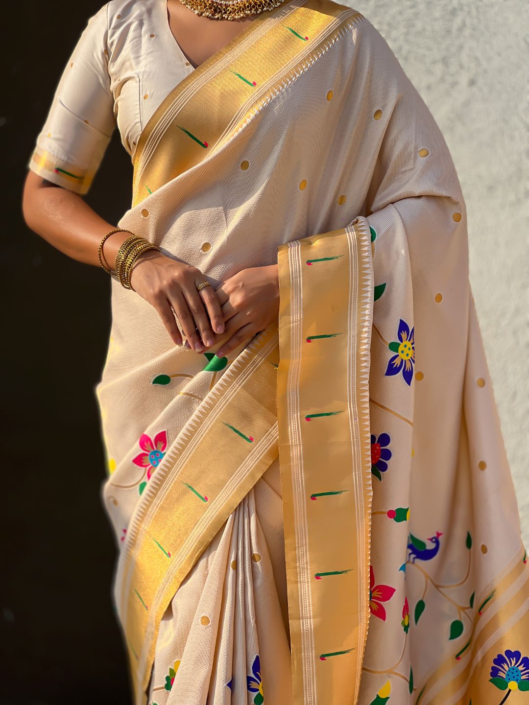 luxury white saree with traditional woven detailing and graceful drape