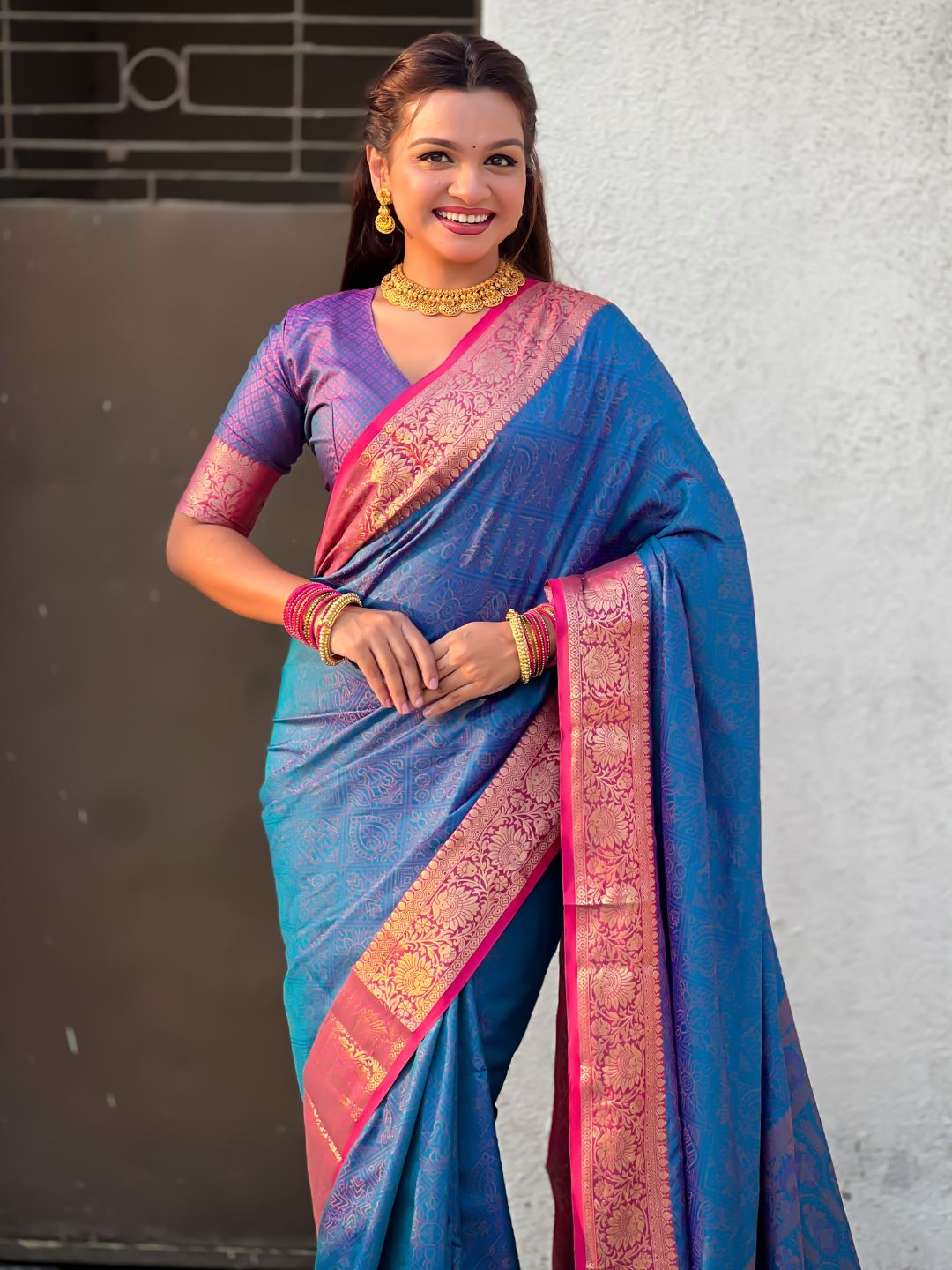 elegant blue silk saree with rich floral woven zari detailing