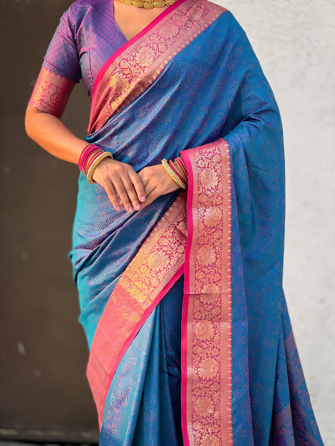ethnic soft silk saree with contrast zari floral border and graceful drape